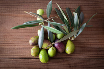 natural olives on rustic wooden background