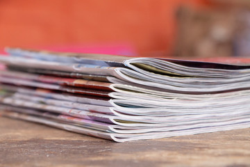 Magazines on wooden table
