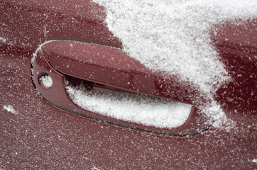 snow covered frozen car lock, the doors freezing car in the winter