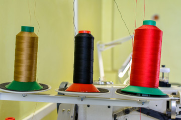 coils spools with threads for weaving machine close-up