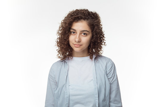 Portrait Of A Pretty Hispanic Young Woman On A White Background.