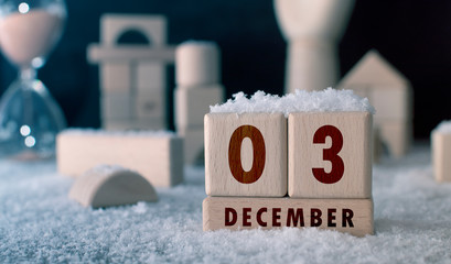 December 3 written with wooden blocks