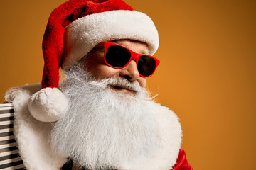 Portrait of elder Saint Nicholas in red sunglasses in studio
