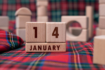 January 14 written with wooden blocks