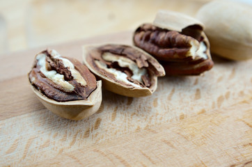 pecan close-up macro high resolution on wooden background