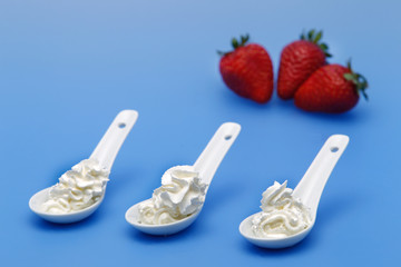 Whipped cream, with strawberries.