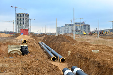 Laying underground storm sewers at a construction site. Groundwater system for new residential...