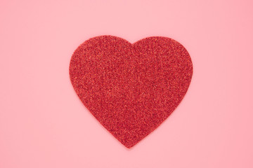 Red heart on abstract pink backgroun, love, Valentines day. Flat lay with copy space. Sparkling red heart.