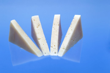 Wedges of cured Manchego cheese.