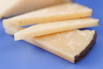 Cured Manchego cheese, derived from sheep's milk.