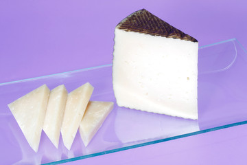 Wedges of cured Manchego cheese.