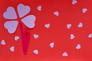 Hearts on the red background. Valentin's Day, top view.  Flat lay. Greeting card.