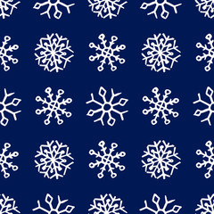 Seamless background of hand drawn snowflakes