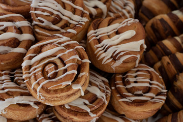 Close up freshly baked pastry goods on display in bakery shop