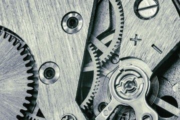 vintage old mechanism with gears and springs, clock mechanism close-up macro, black and white photo