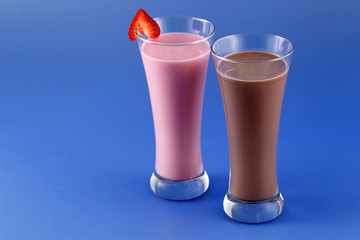 Strawberry and chocolate milkshake, sweet drink made with cow's milk.