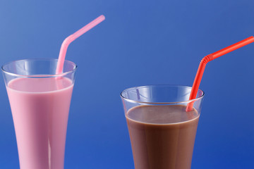 Strawberry and chocolate milkshake, sweet drink made with cow's milk.