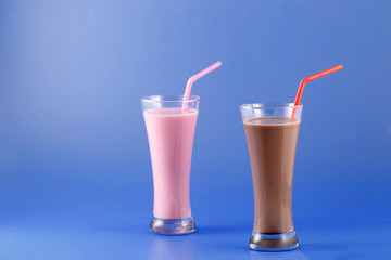 Strawberry and chocolate milkshake, sweet drink made with cow's milk.