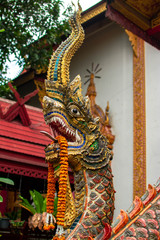 Fototapeta na wymiar Golden dragon statue in Thai temple