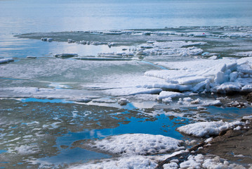 Blue water and ice on a clear sunny day