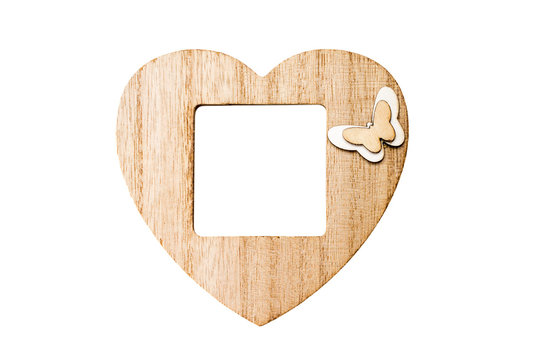 wooden photo frame in the form of a heart with free space, copy space, mock up, isolated on white background