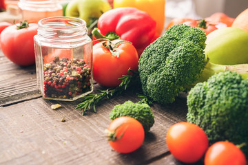 Cooking vegetables on the wooden table background top view