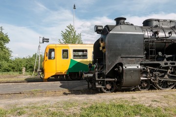 Fototapeta na wymiar Meeting of diesel and steam locomotives