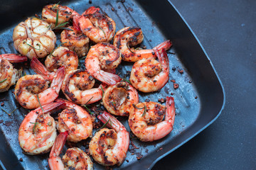 Grilled tiger shrimps with spice and lemon. Grilled seafood.. Shrimps prawns brochette kebab. Barbecue srimps prawns.