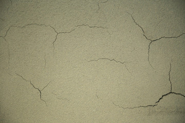 Close up of fresh dried lime plaster cracking. Lime plaster is an ecological alternative without any chemical additives