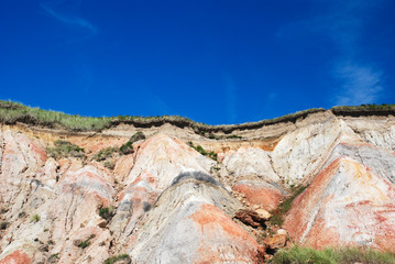 photo of colorful cliffs with deep blue sky
