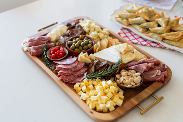 Assorted charcuterie board on kitchen table
