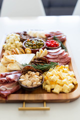 Assorted charcuterie board on kitchen table
