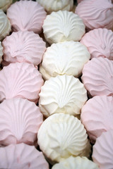 White and pink zephyrs as background.  marshmallows close up.