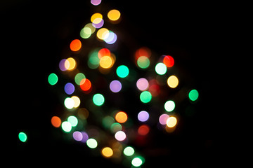 blur light bokeh color red green yellow on background black.