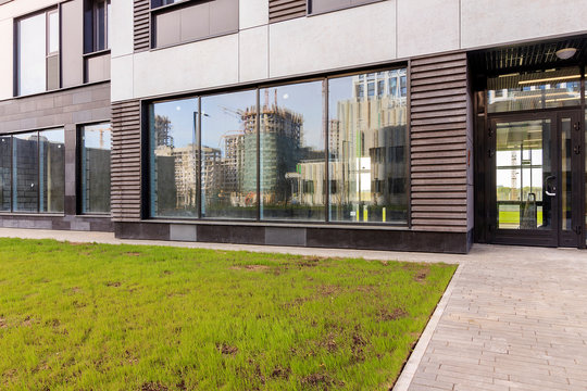 Panoramic window of modern residential building view outside. Insulating glass (glazing, pane). Storm windows. Ground floor apartment. first for shops, offices. commercial premises. Rainscreen. Door