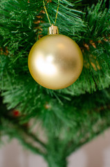 Christmas ball toy on a Christmas tree. New Year tree concept. Preparing for the winter holidays.