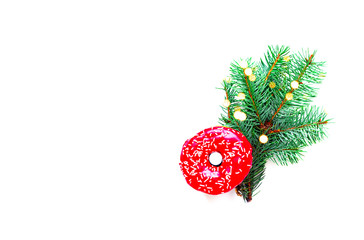 Colored donut with colorful sprinkles on white background. Christmas background. Copy space