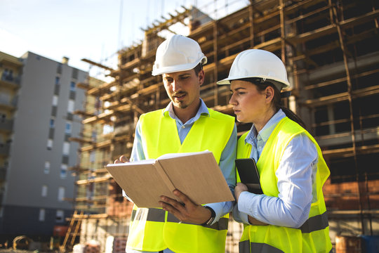 Construction workers having work meeting