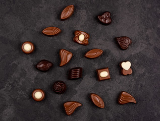Chocolate pralines on dark background