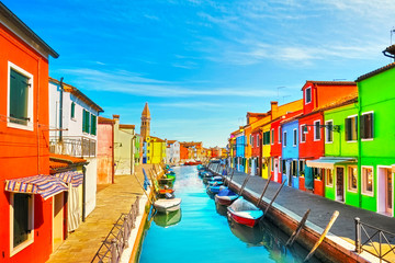 Fototapeta na wymiar Venice landmark, Burano island canal, colorful houses, church and boats, Italy
