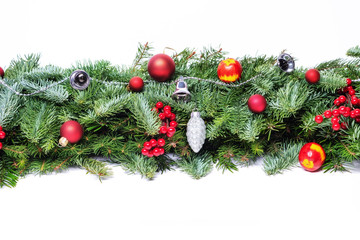 Christmas decorative background border with red bauble decorations and holly berries