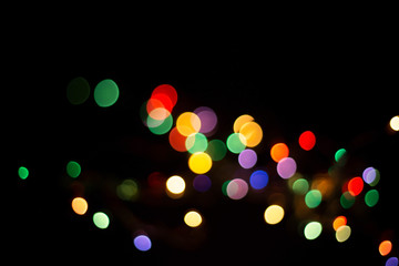 blur light bokeh color red green yellow on background black.