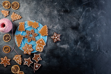 Various decorated gingerbread cookies on a plate