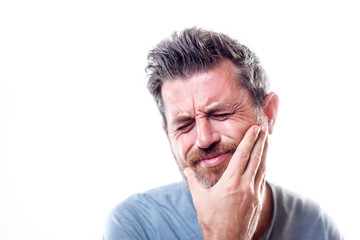 Obraz premium Man feels strong toothache isolated. People, healthcare and medicine concept