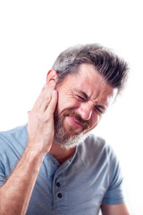 Man feels ear pain isolated. People, healthcare and medicine concept