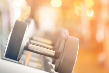 Rows of dumbbells in the gym close-up. Toning.  