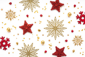 Red and gold christmas decorations on white background, flat lay, top view