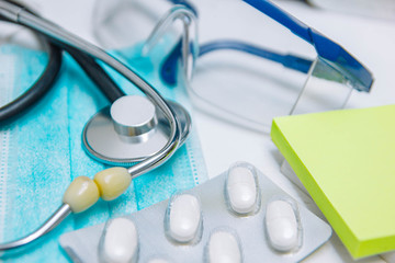 medical drugs, stethoscope. Hospital treatment concept.
