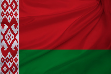 beautiful photo of a colored national flag of the modern state of Belarus on a textured fabric, concept of tourism, emigration, economy and politics, closeup