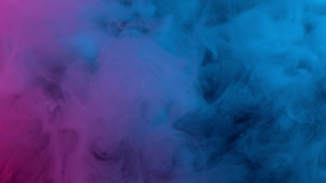 Slow motion of coloured smoke effect with neon lights
